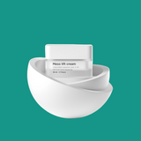 White jar of Meso lift cream on a white background